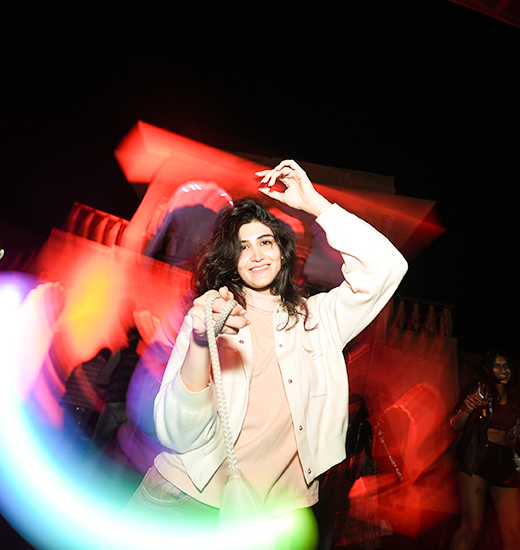 A dancer lost in the red light of the night floor